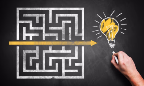 hand drawing a shortcut through a maze to an idea